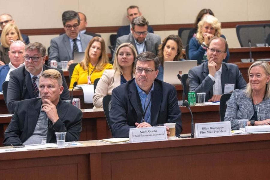 Audience members listening to panels at the Chicago Payments Symposium.