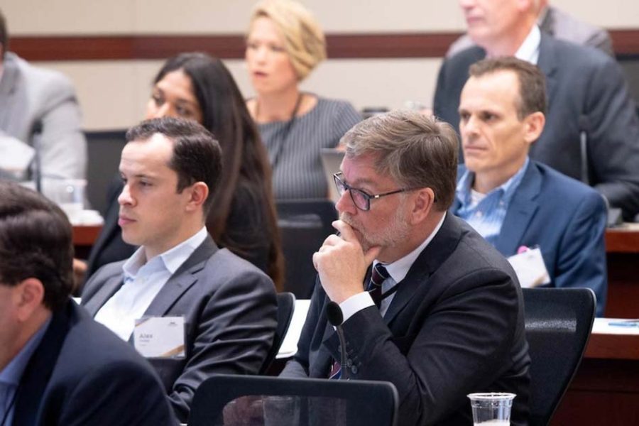 Chicago Payments Symposium audience members listening to the panelists.